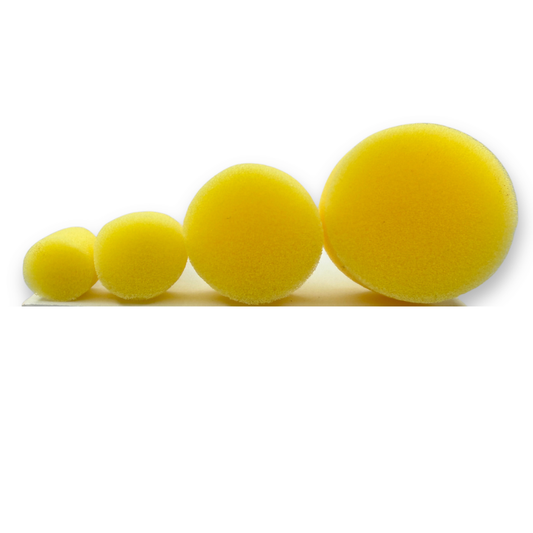 Top view of the four yellow foam heads included in the SillyFarm Pouncy Pouncers Pack of 4, showing the different diameters for creating circles, blended shading, and face paint designs.