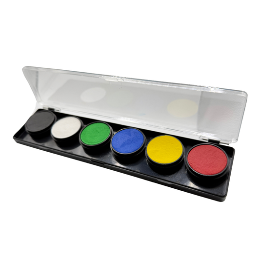 Open FAB face paint palette with six round water-activated colors in black, white, green, blue, yellow, and red. The paints are arranged in a black plastic case with a clear hinged lid, photographed on a light gray background.