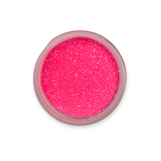 close up of a jar filled with hot pink glitter