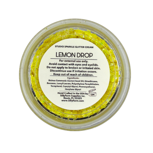 Back view of the SillyFarm Lemon Drop Studio Sparkle Glitter Cream 25g jar showing the product label with ingredients, directions for use, and handcrafted in the USA information.