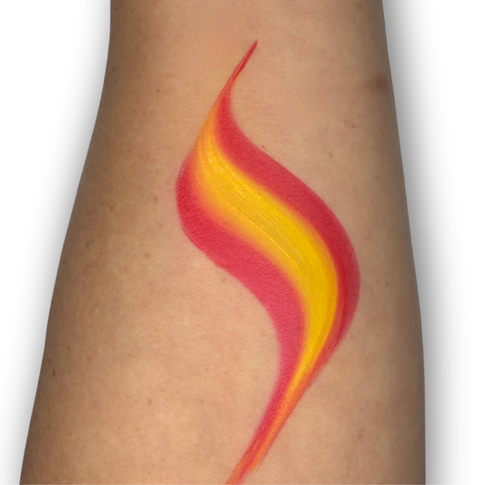 Red and yellow one-stroke swatch created with the Spain Flag Arty Cake, demonstrating smooth blended stripes and crisp tapered edges for fast flame designs with a single brush stroke.