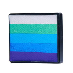 Image of a Rainbow Face Paint Cake featuring a palette of bright colors arranged in stripes. Designed for easy application, this face paint allows artists to create bold, blended, multi-color designs with a single swipe. Ideal for a variety of themes and festive occasions.