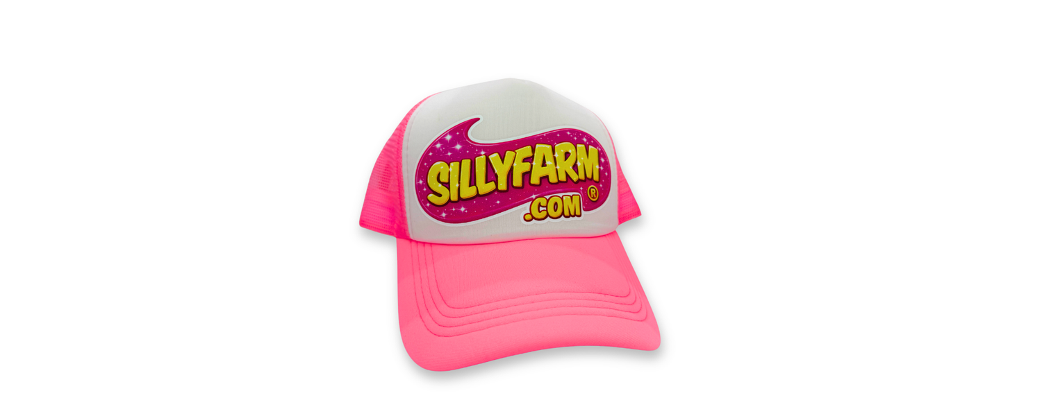 Bright pink and white SillyFarm trucker hat with embroidered logo, designed for face painters, makeup artists, and creative professionals.
