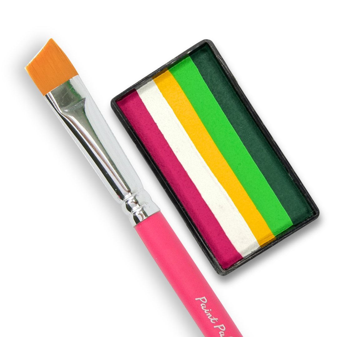 A paint brush with a bright pink handle and orange bristles, shown next to a rectangular paint palette containing four vertical stripes of magenta, white, yellow, and green paint on a white background.