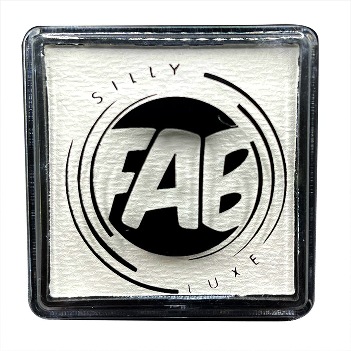 A close-up of a container of Silly Farm FAB Luxe white face and body paint with the brand logo visible on the label.