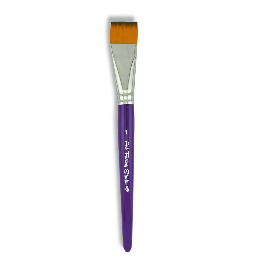 A flat paint brush with a purple handle, silver ferrule, and orange bristles, shown vertically on a white background. The handle features white text that reads 'Art Factory Studio' with a small logo.