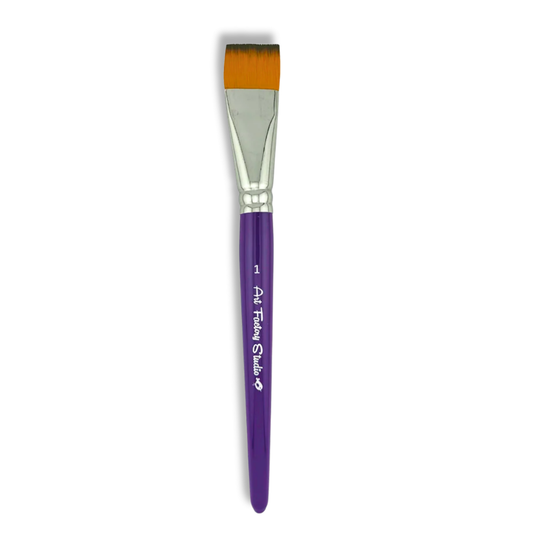 A flat paint brush with a purple handle, silver ferrule, and orange bristles, shown vertically on a white background. The handle features white text that reads 'Art Factory Studio' with a small logo.
