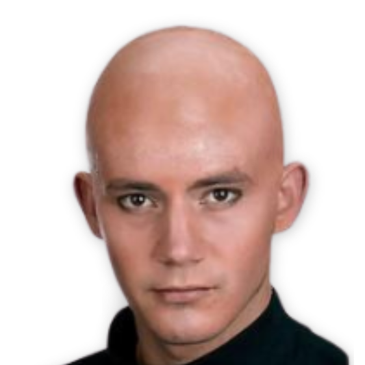 A close-up portrait of a bald man with light skin and dark eyes, wearing a black turtleneck, set against a plain white background.