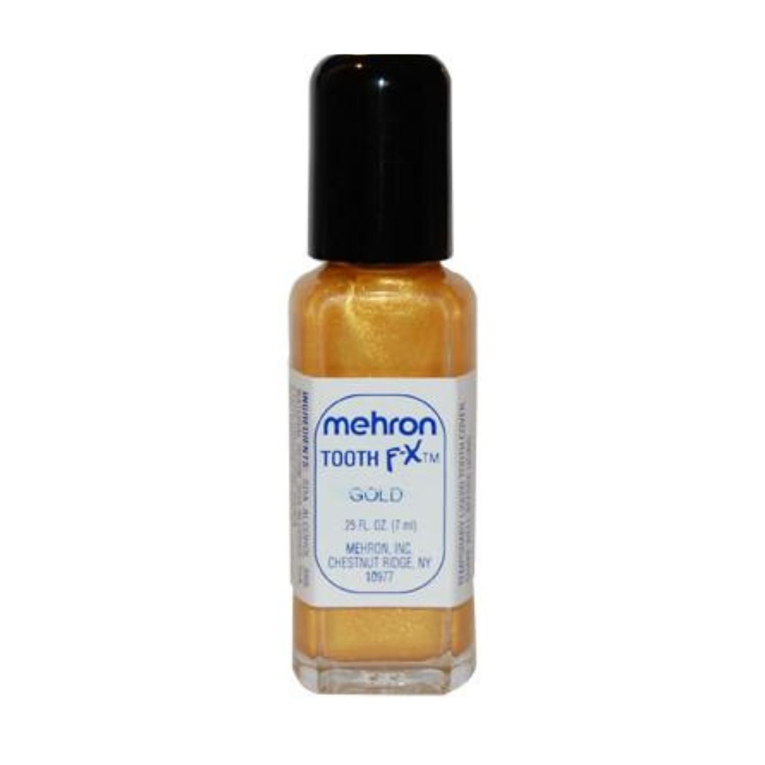 A bottle of Mehron Tooth FX Gold liquid makeup, showing the gold-colored formula inside a clear glass bottle with a black cap and a white label.