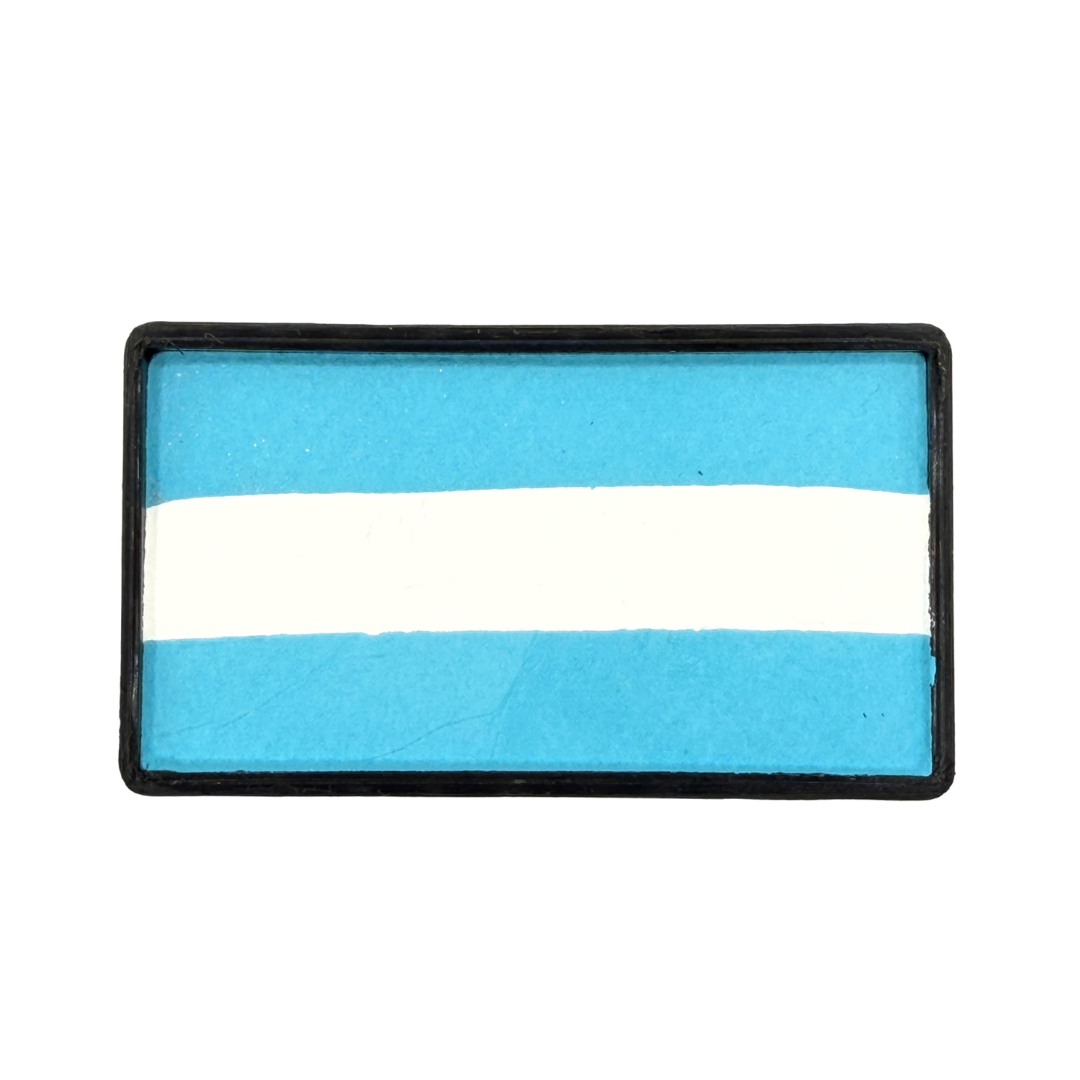 Rectangular one-stroke face paint cake with sky blue and white horizontal stripes inside a black plastic container, inspired by the colors of the Argentina flag for soccer fan face painting and cheek flags.