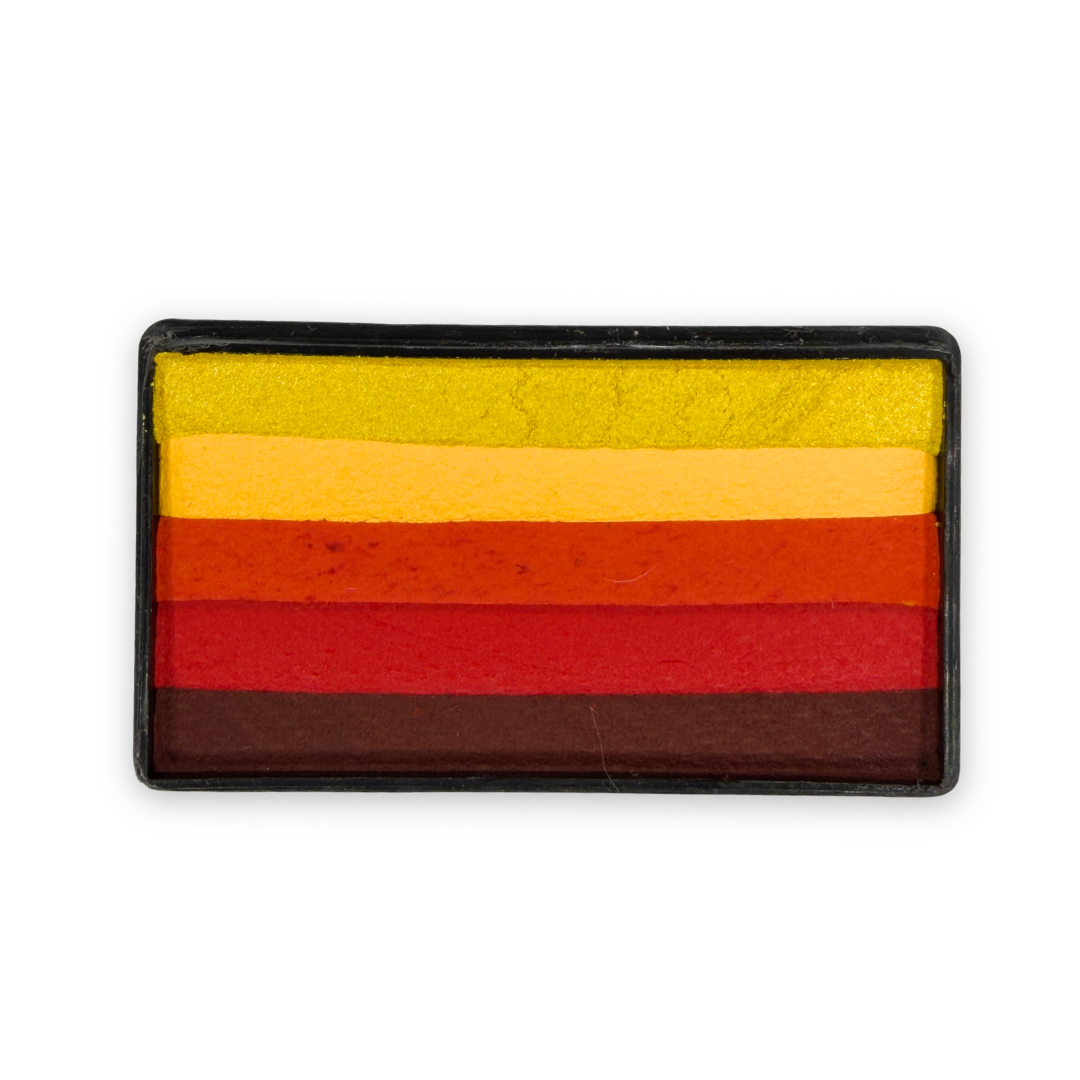 Autumn Arty Cake face paint with layered stripes of metallic gold, peach, orange, red, and dark brown in a rectangular container.