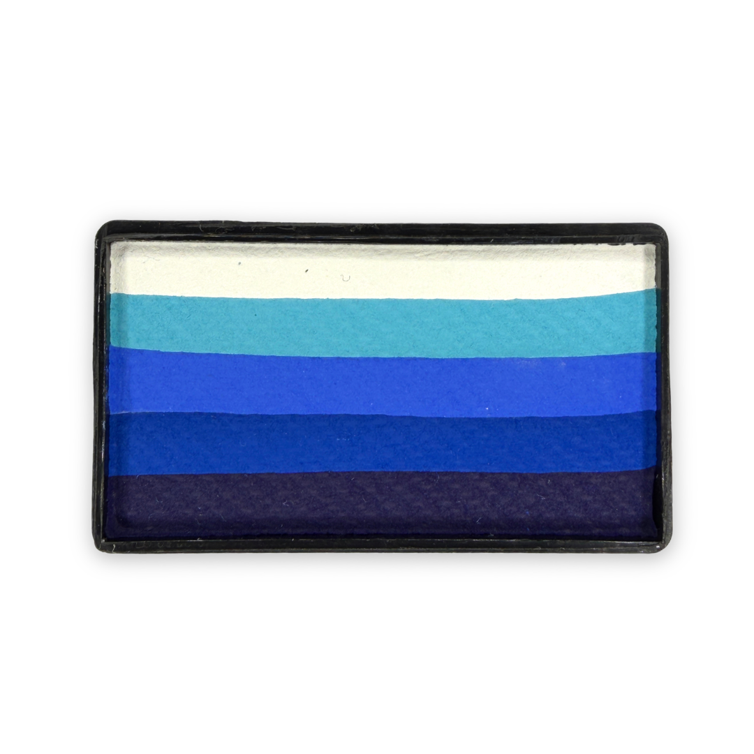 Out of the Blue Arty Cake 28g one-stroke face paint featuring five layered shades from white to deep navy in a rectangular cake for creating smooth blue gradients in ocean, winter, and fantasy face painting designs.