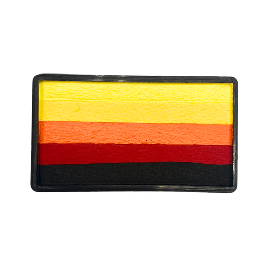 Rectangular one-stroke face paint cake with layered flame-inspired tones including bright yellow, pale yellow, orange, red, and black inside a black plastic container.