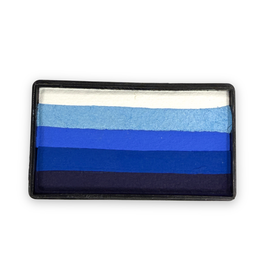 Out of the Blue Arty Cake 28g one-stroke face paint featuring five layered shades from white to deep navy in a rectangular cake for creating smooth blue gradients in ocean, winter, and fantasy face painting designs.