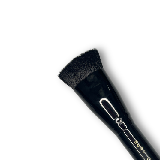 Close up of Body Color Cosmetics Oval Kabuki Stiletto face painting brush with large black oval bristles designed for fast base coverage and blending.