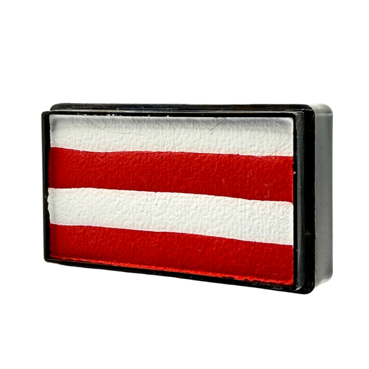 Rectangular one-stroke face paint cake with alternating bright red and white horizontal stripes inside a black plastic container, designed for creating crisp striped effects with a flat or angled brush.