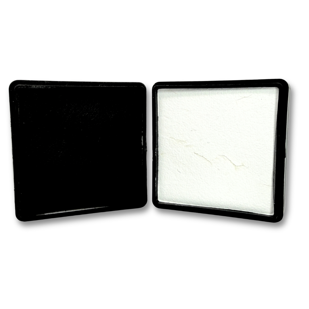 Set of black and white fab luxe face paint in square black pans displayed side by side