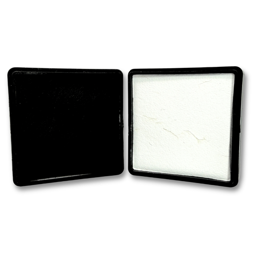 Set of black and white fab luxe face paint in square black pans displayed side by side