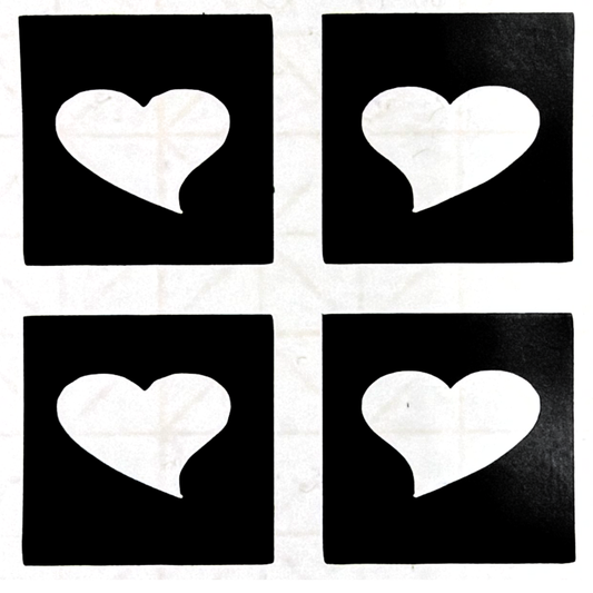 Glitter tattoo stencil featuring four small heart designs with medical-grade adhesive for creating crisp cosmetic glitter tattoos.