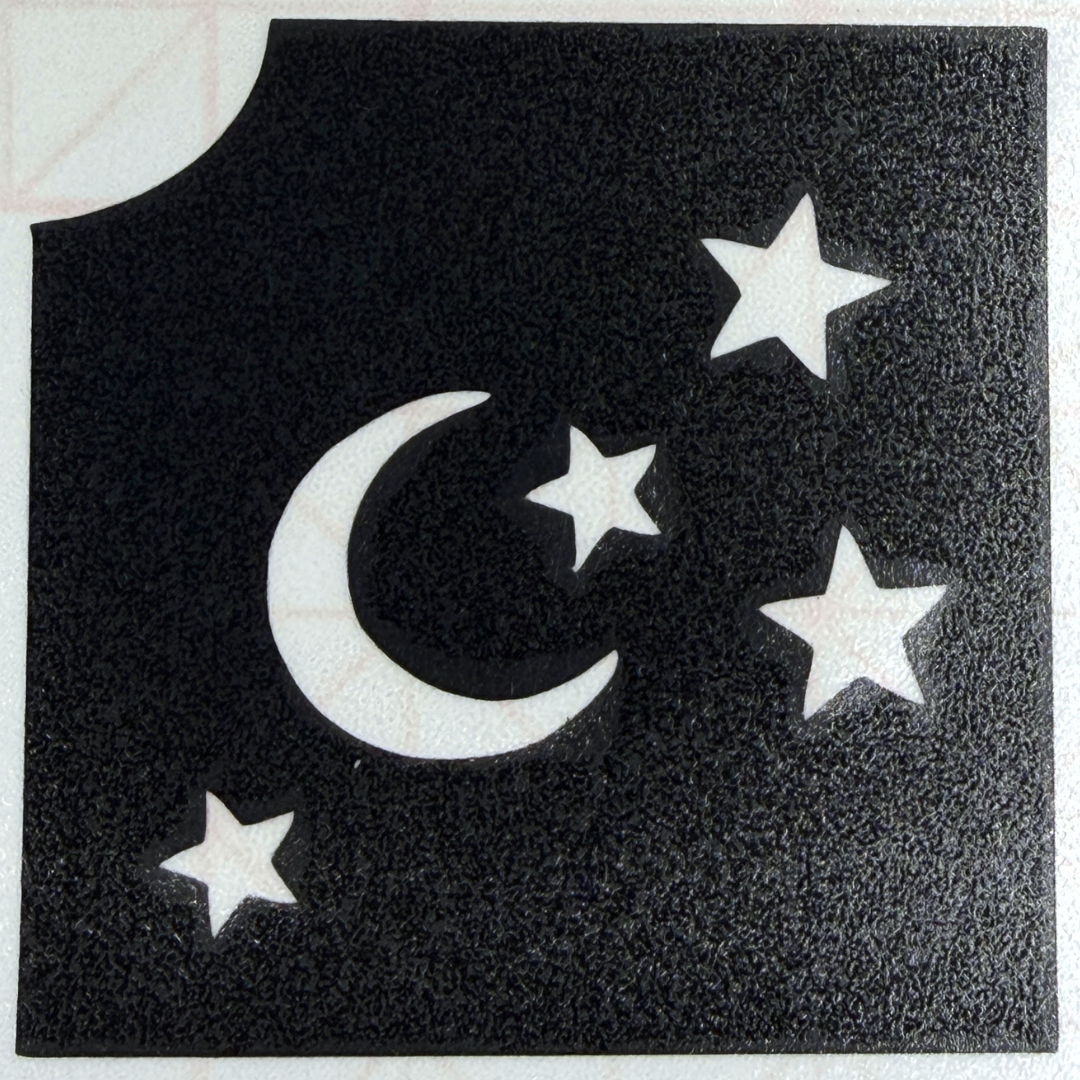 Moon and stars glitter tattoo stencil featuring a crescent moon and four stars on a professional self-adhesive 2-inch stencil.