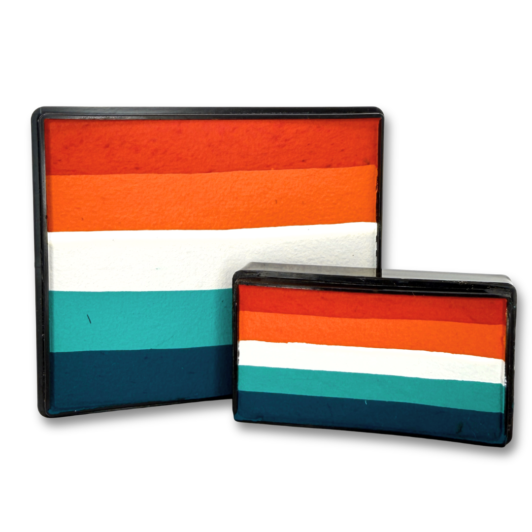Laces Out Rainbow and Arty Cakes Set featuring orange, white, aqua and deep teal layered face paints in 50g and 28g sizes.
