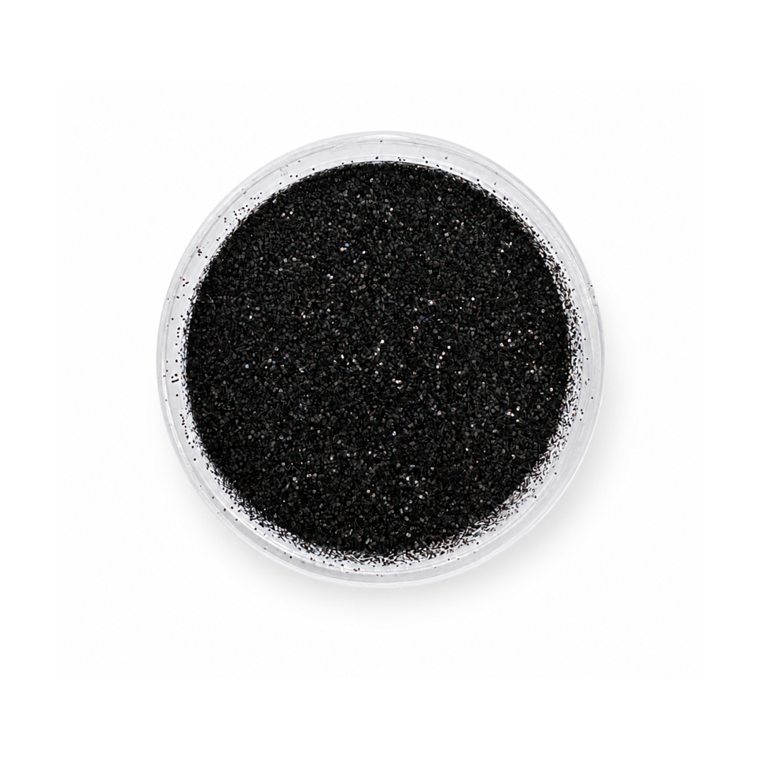 closeup of an open jar filled with black glitter