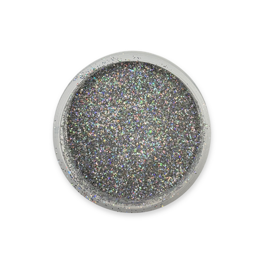 Round metallic object with glittery texture on a white background