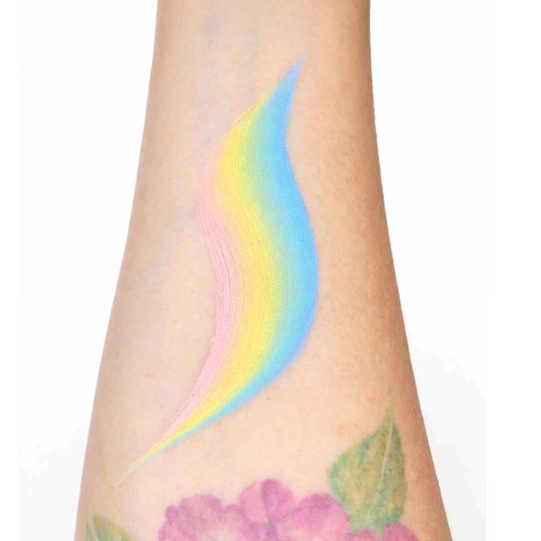One stroke pastel colored face paint swatch on a person's arm