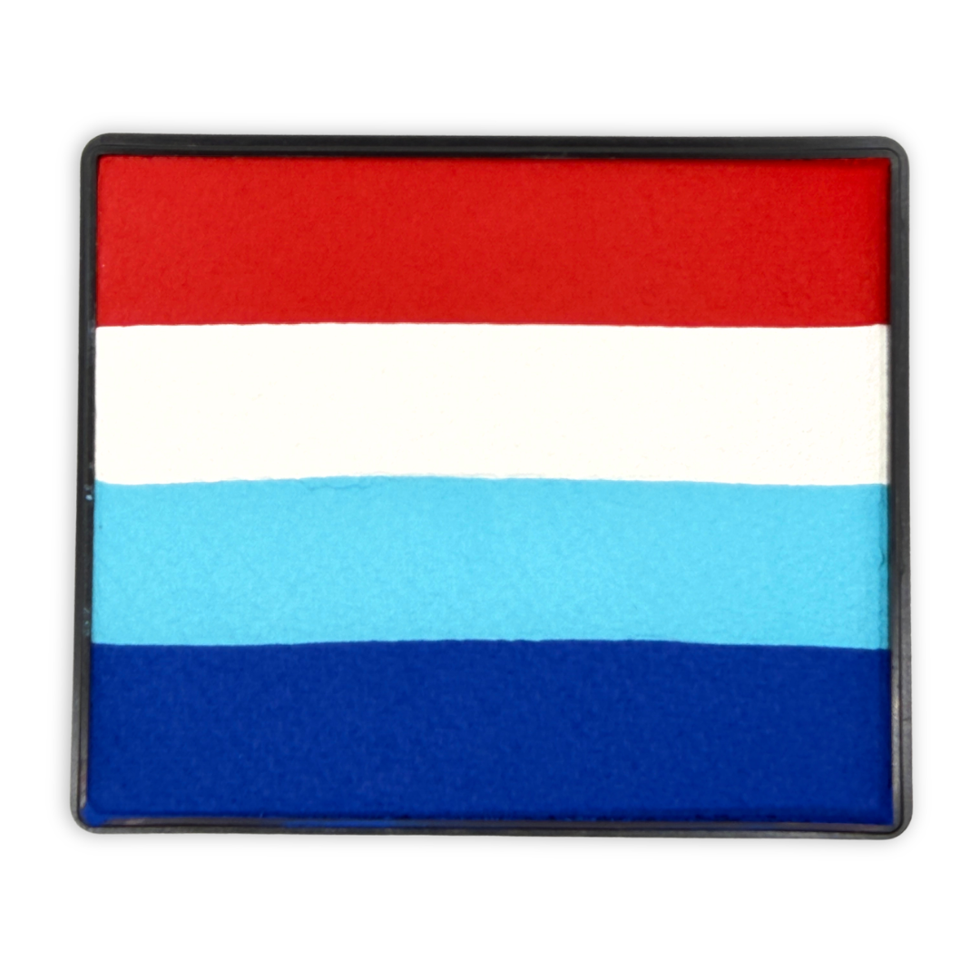 Rectangular rainbow cake face paint with horizontal stripes of bright red, white, light blue, and royal blue inside a black plastic container, designed for fast multi-color face painting and patriotic-themed designs.