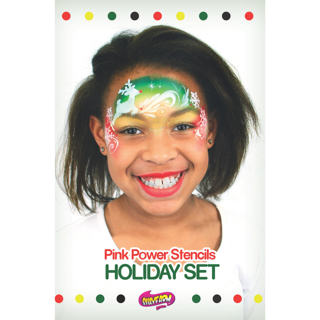 Holiday Pink Power Stencil Set by SillyFarm featuring a smiling child wearing a festive Christmas face paint design with a reindeer, snowflakes, and holiday colors, with the product title displayed below.