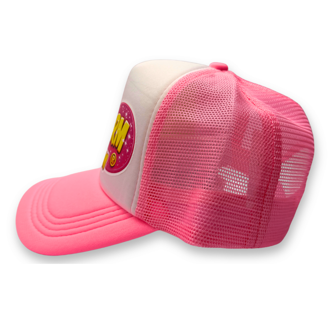 Side view of the SillyFarm Pink Trucker Snapback Hat showing the bright pink curved bill, breathable pink mesh back, white foam front panel, and adjustable snapback closure.
