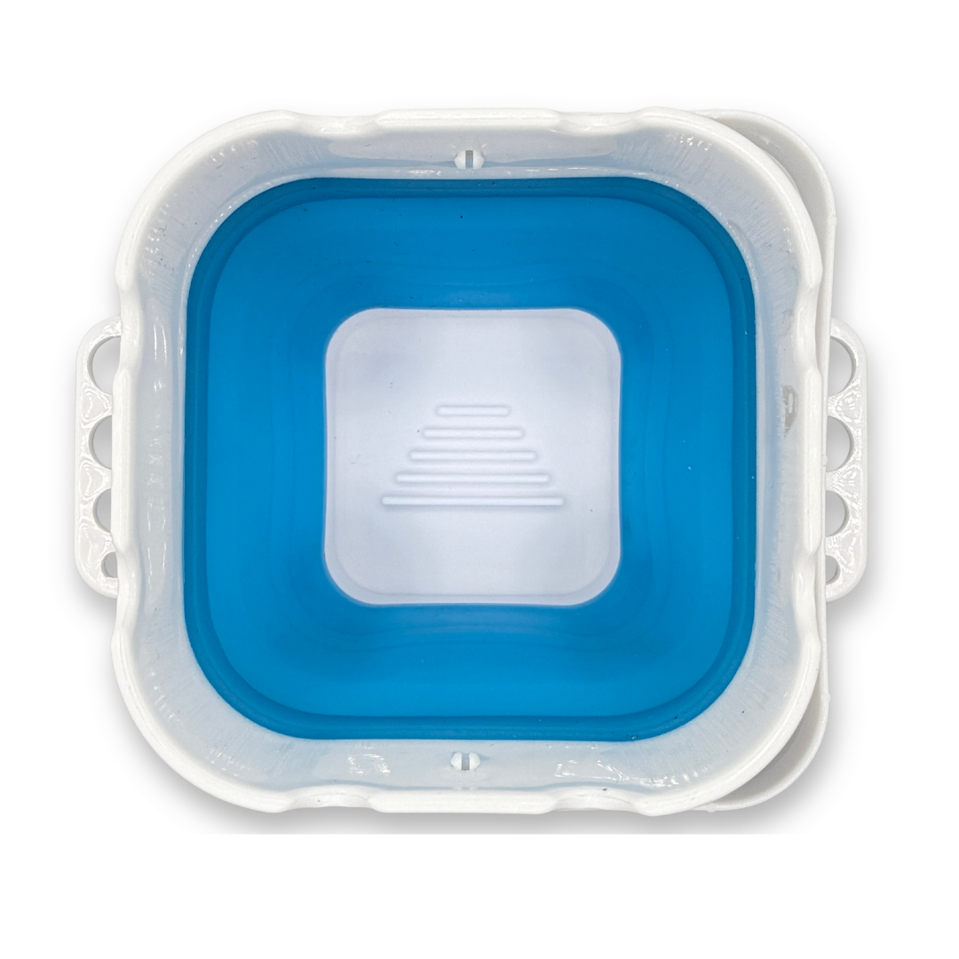 Top view of the blue SillyFarm Pop n Go Collapsible Water Cup showing the square opening, silicone interior, and multiple built-in brush rests around the rim.