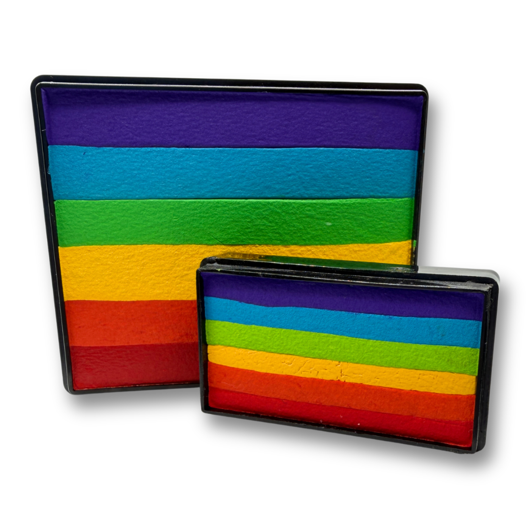 True Rainbow Cake and matching Arty Cake featuring coordinated stripes of purple, blue, green, yellow, orange, and red face paint displayed together as a one-stroke face paint bundle.