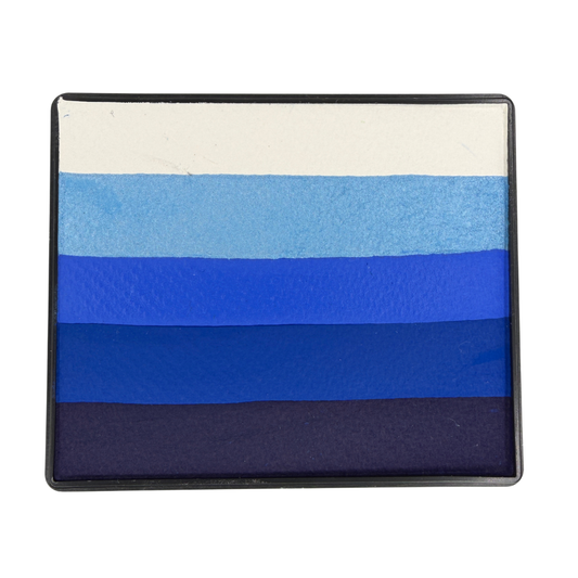 Blue gradient Rainbow Cake face paint with layered stripes of white, light blue, bright blue, royal blue, and deep navy in a rectangular container.