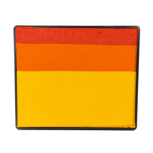 Tiger-inspired Rainbow Cake face paint with layered stripes of bright yellow, orange, and reddish-orange in a rectangular container.