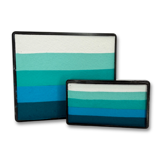 Sea Glass Rainbow Cake and matching Arty Cake featuring coordinated shades of white, mint, teal, turquoise, blue, and deep teal face paint displayed together as a one-stroke face paint bundle.