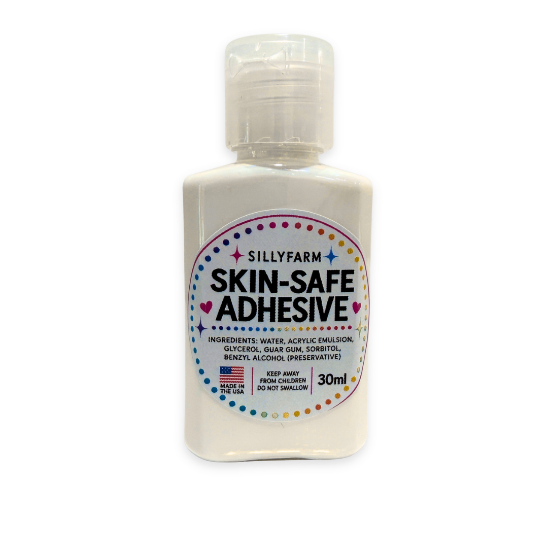A 30ml bottle of Silly Farm Skin-Safe Adhesive with a white cap and a white bottle body, featuring a colorful circular label with black text.