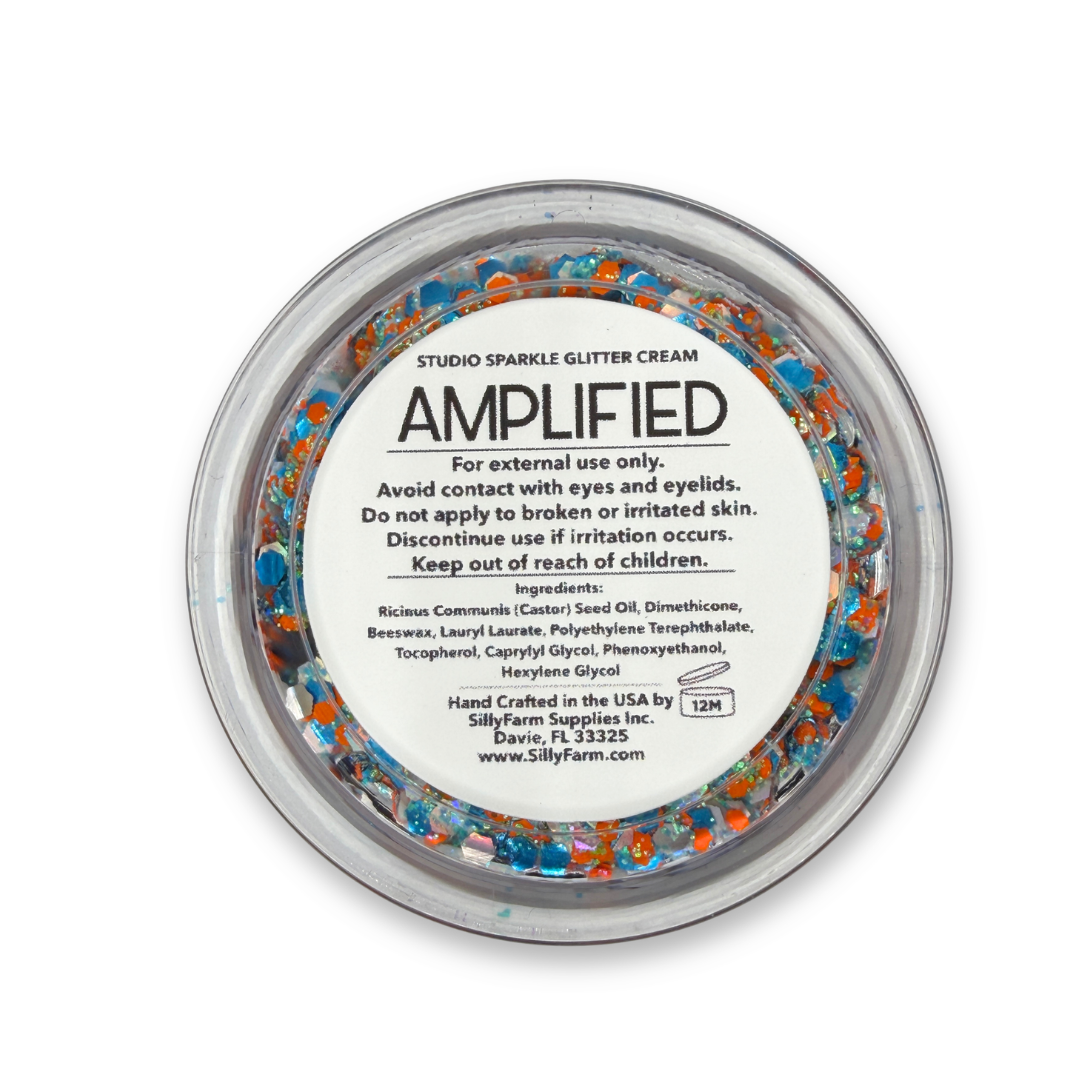 Back view of Amplified Studio Sparkle Glitter Cream in a clear round cosmetic jar showing the product label, ingredients, safety information, and usage details.