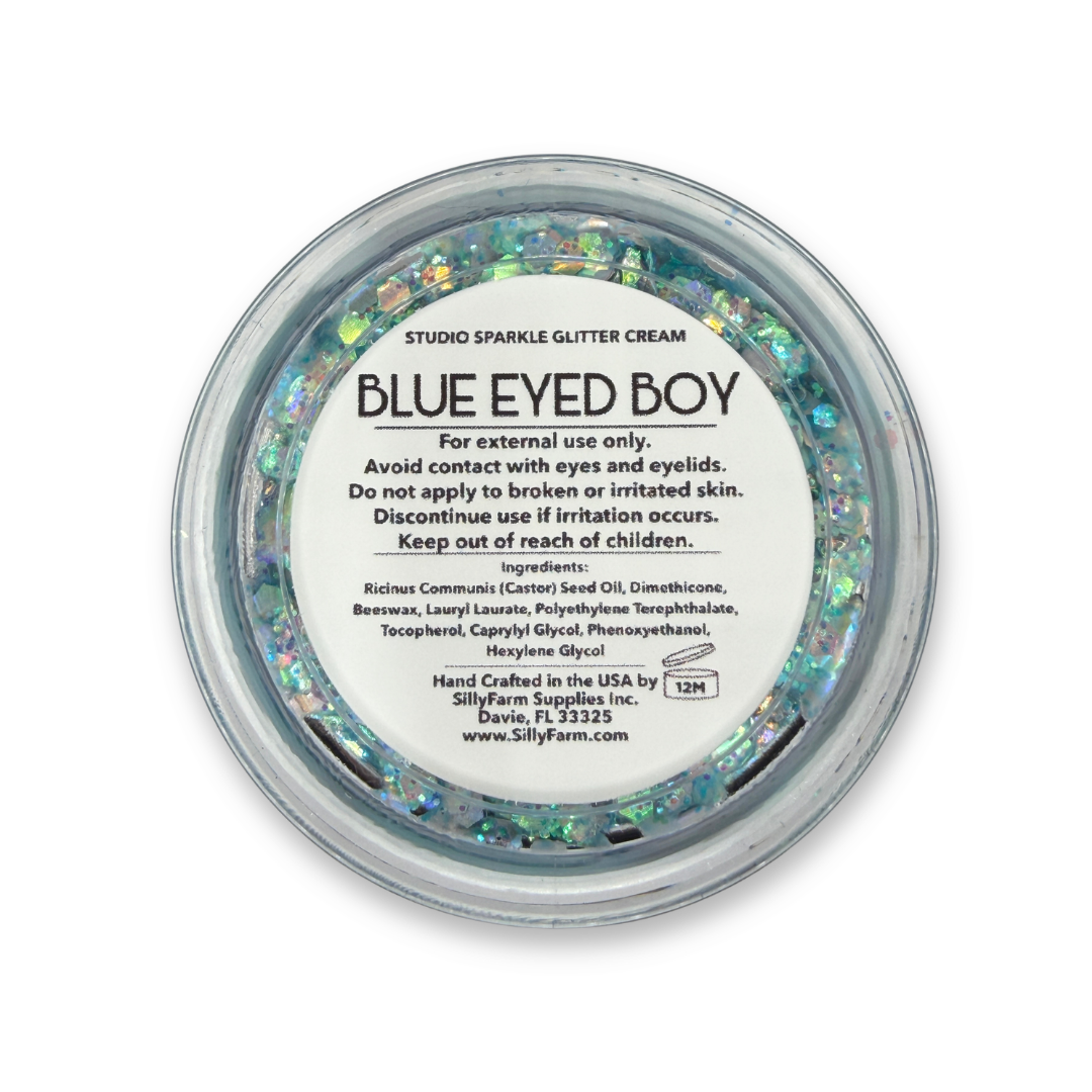 Back view of Blue Eyed Boy Studio Sparkle Glitter Cream container showing the product label, ingredients, safety information, and usage details.