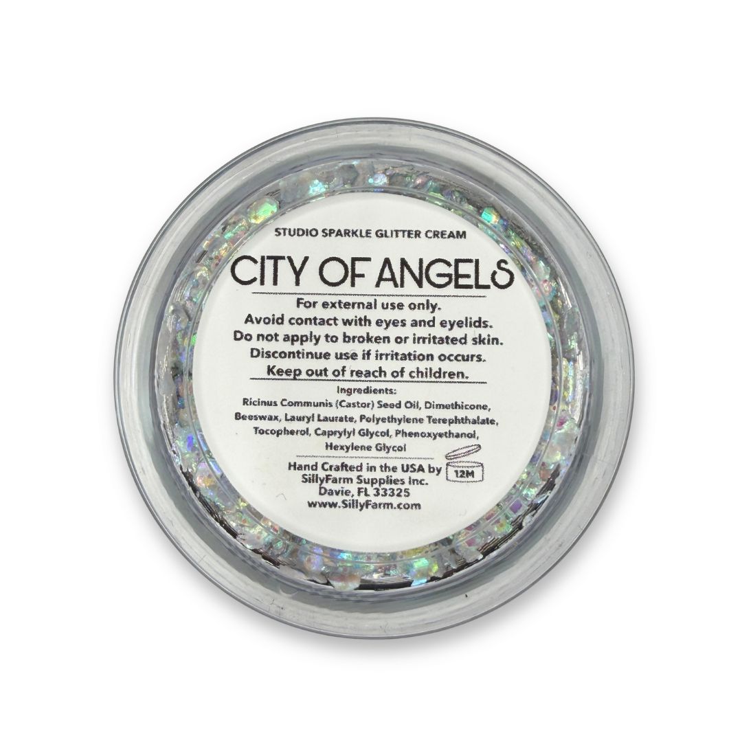 Back view of City of Angels Studio Sparkle Glitter Cream container showing the product label, ingredients, safety information, and usage details. ✨