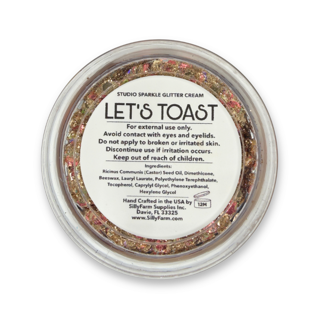 Back view of Let's Toast Studio Sparkle Glitter Cream container showing the product label, ingredients, safety information, and usage details. 