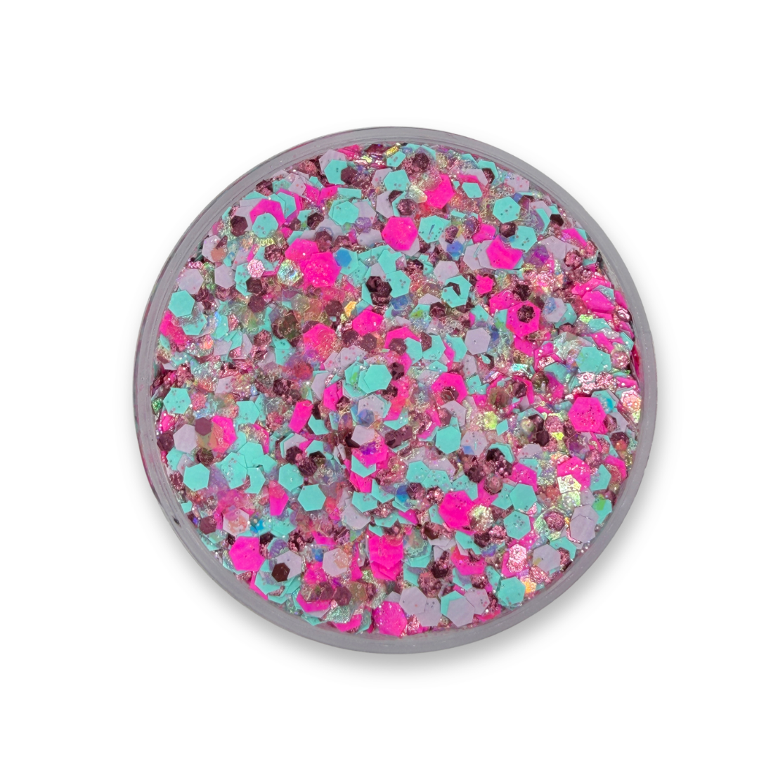 Open jar of Zack ♥ Kelly Studio Sparkle Glitter Cream showing chunky neon pink, aqua blue, lavender, rose gold, and iridescent cosmetic glitter mix.