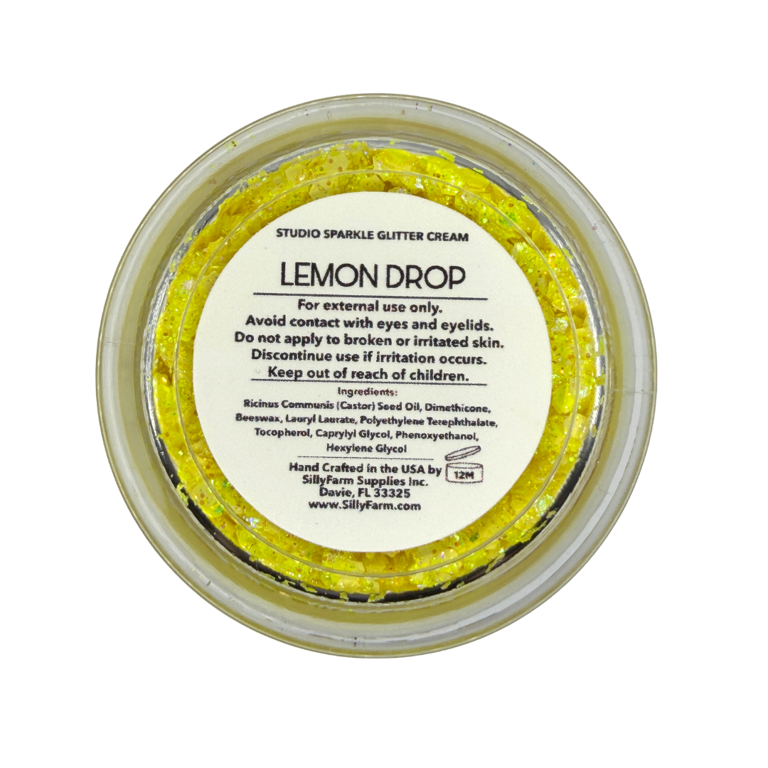 Back view of the SillyFarm Lemon Drop Studio Sparkle Glitter Cream 25g jar showing the product label with ingredients, directions for use, and handcrafted in the USA information.