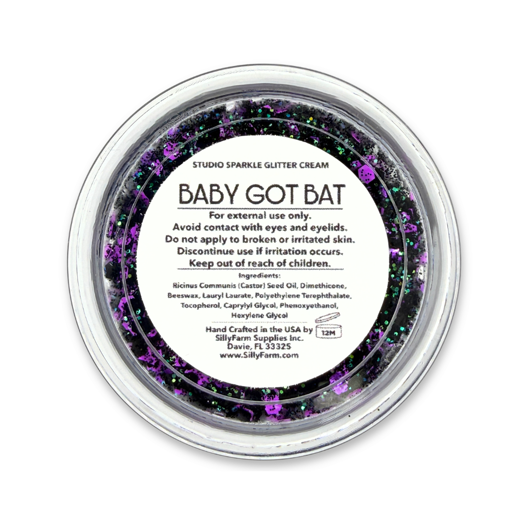 Close-up of Baby Got Bat purple and black Studio Sparkle Glitter Cream with iridescent sparkle.