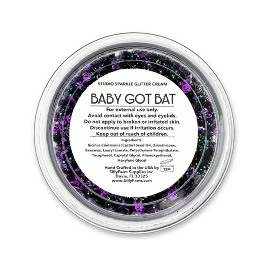 Close-up of Baby Got Bat purple and black Studio Sparkle Glitter Cream with iridescent sparkle.