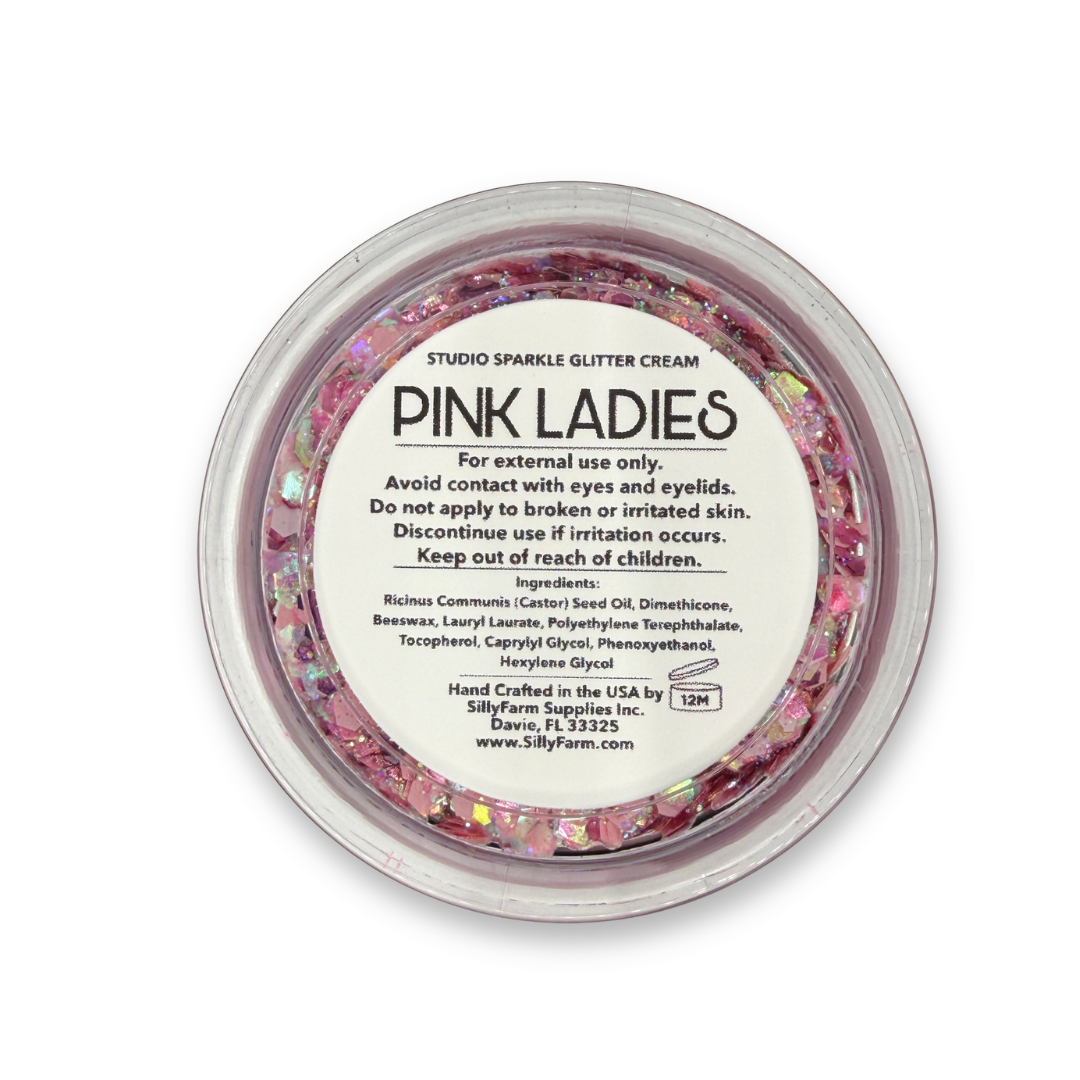 Bottom view of Pink Ladies Studio Sparkle Glitter Cream by SillyFarm showing the product name Pink Ladies, ingredients, safety information, and manufacturer details on the jar label.
