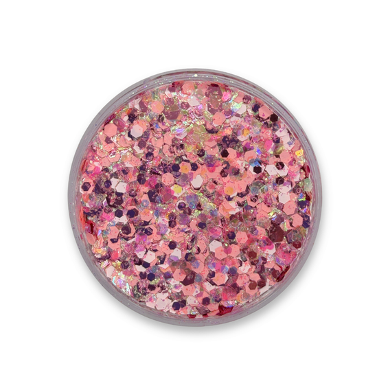 Top view of Pink Ladies Studio Sparkle Glitter Cream by SillyFarm featuring a blend of chunky pink, rose pink, and iridescent cosmetic glitter in a clear 25g jar.