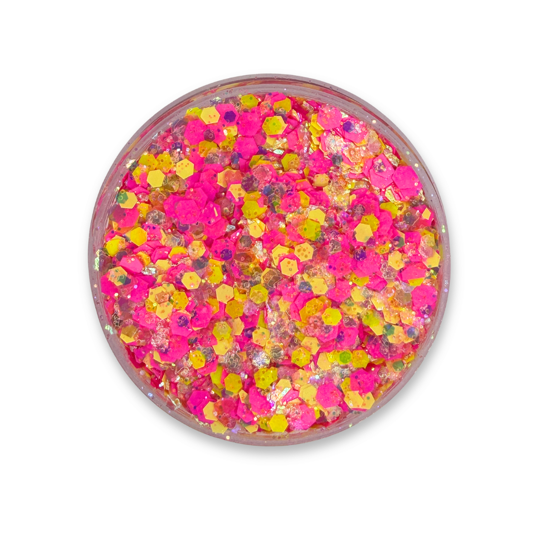Open jar of SillyFarm Spirit Studio Sparkle Glitter Cream featuring bright pink, yellow, and iridescent cosmetic glitter in a smooth cream base. Limited edition 25g glitter cream inspired by the signature SillyFarm colors.