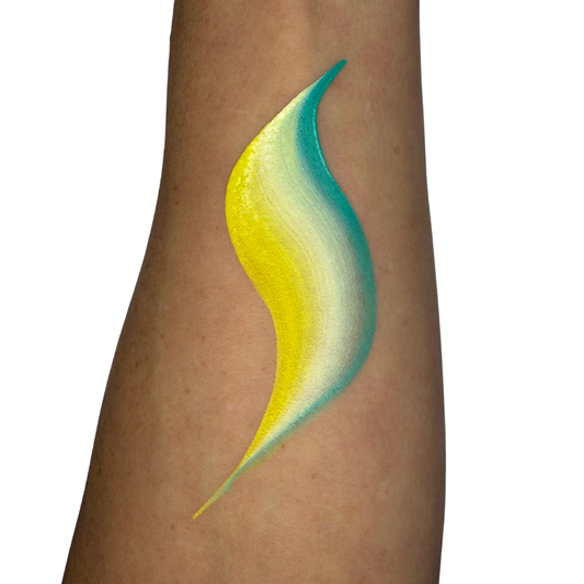 face paint swatch on skin of yellow, white, teal and green