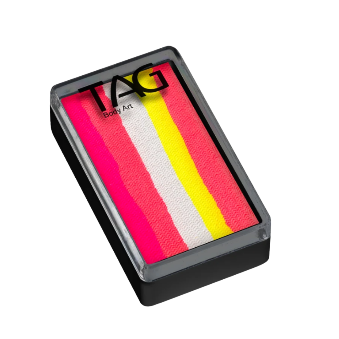 TAG Flamingo 1 Stroke Split Cake 30g in a black rectangular case with a clear TAG Body Art lid, featuring bright neon pink, magenta, white, and yellow Special FX paint.